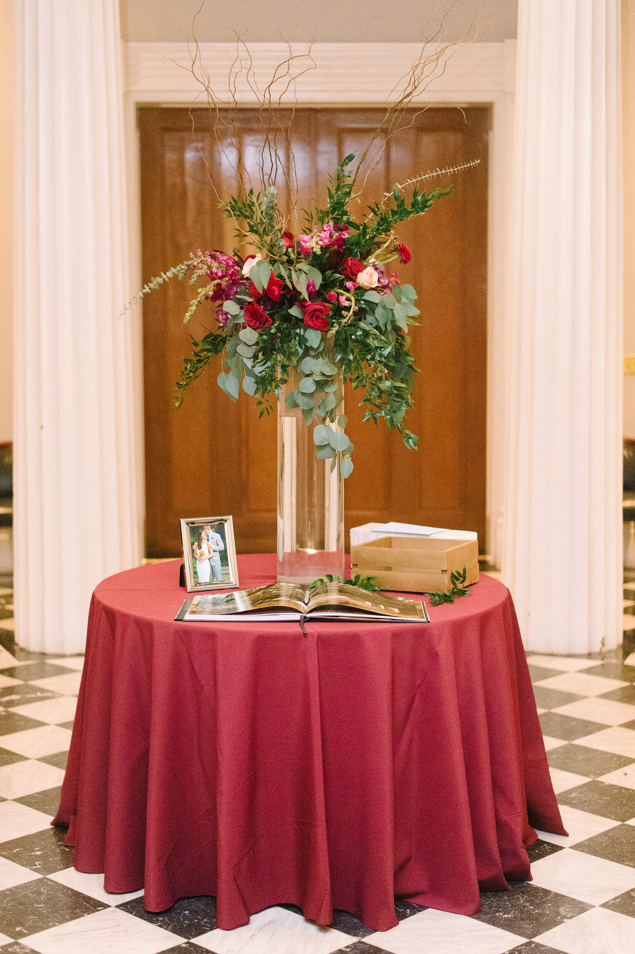 red guestbook table setup inspo floral